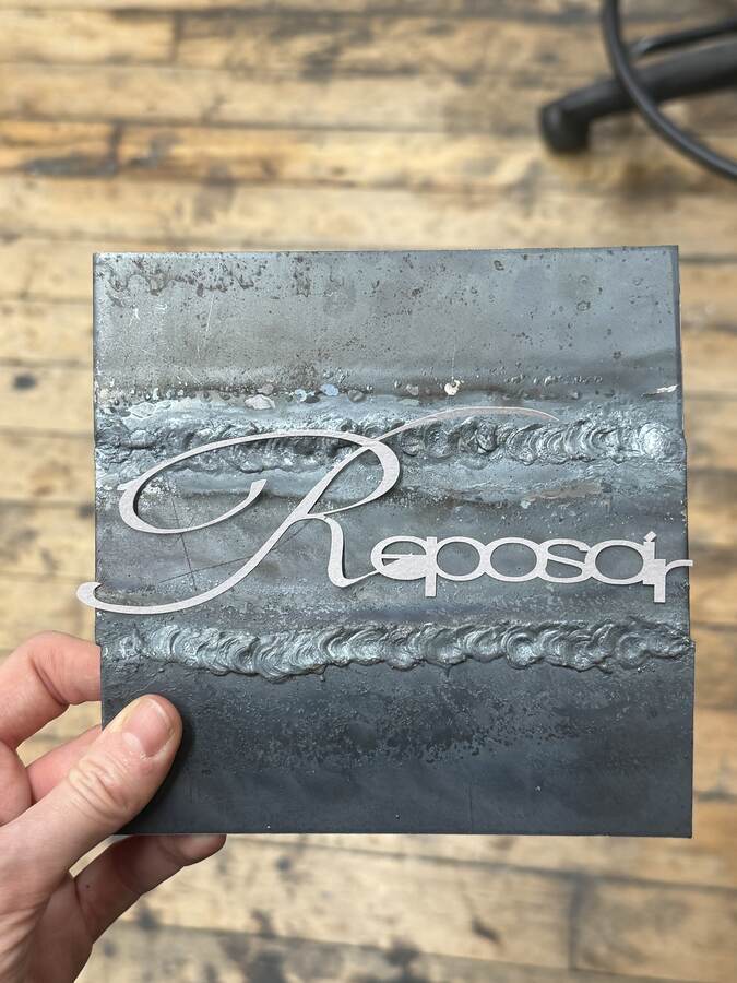 Invitation, cut and welded steel.