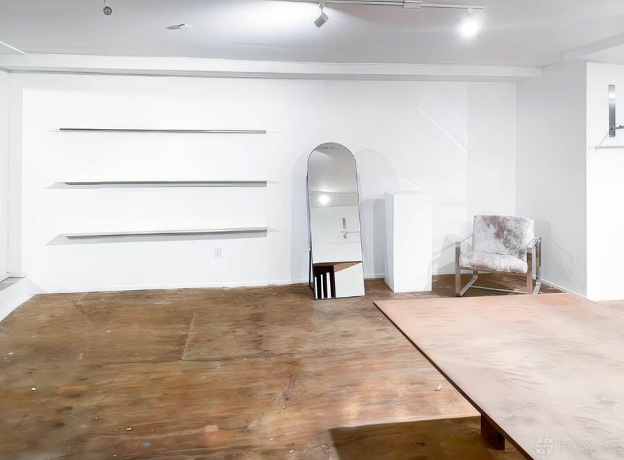 Shelving wall and arched niche.