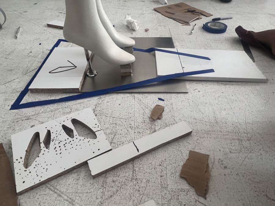 Templates cut and laid out on the studio floor.